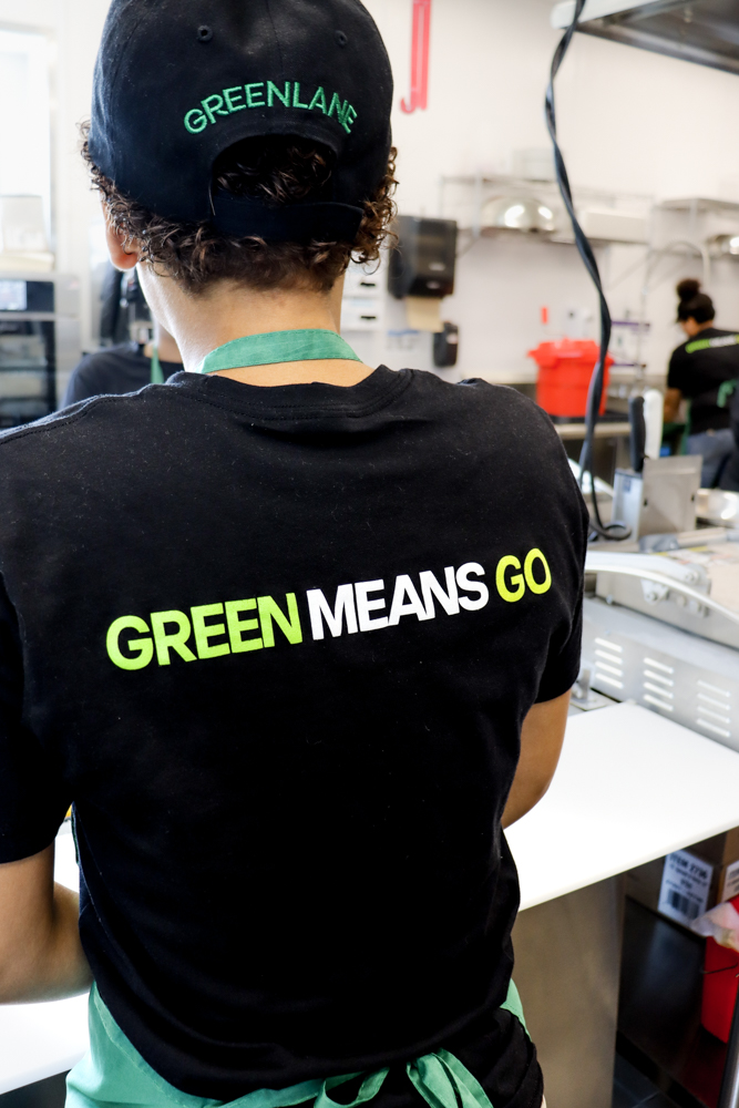 GREENLANE Team Member Branding Employee in “Green Means Go” uniform