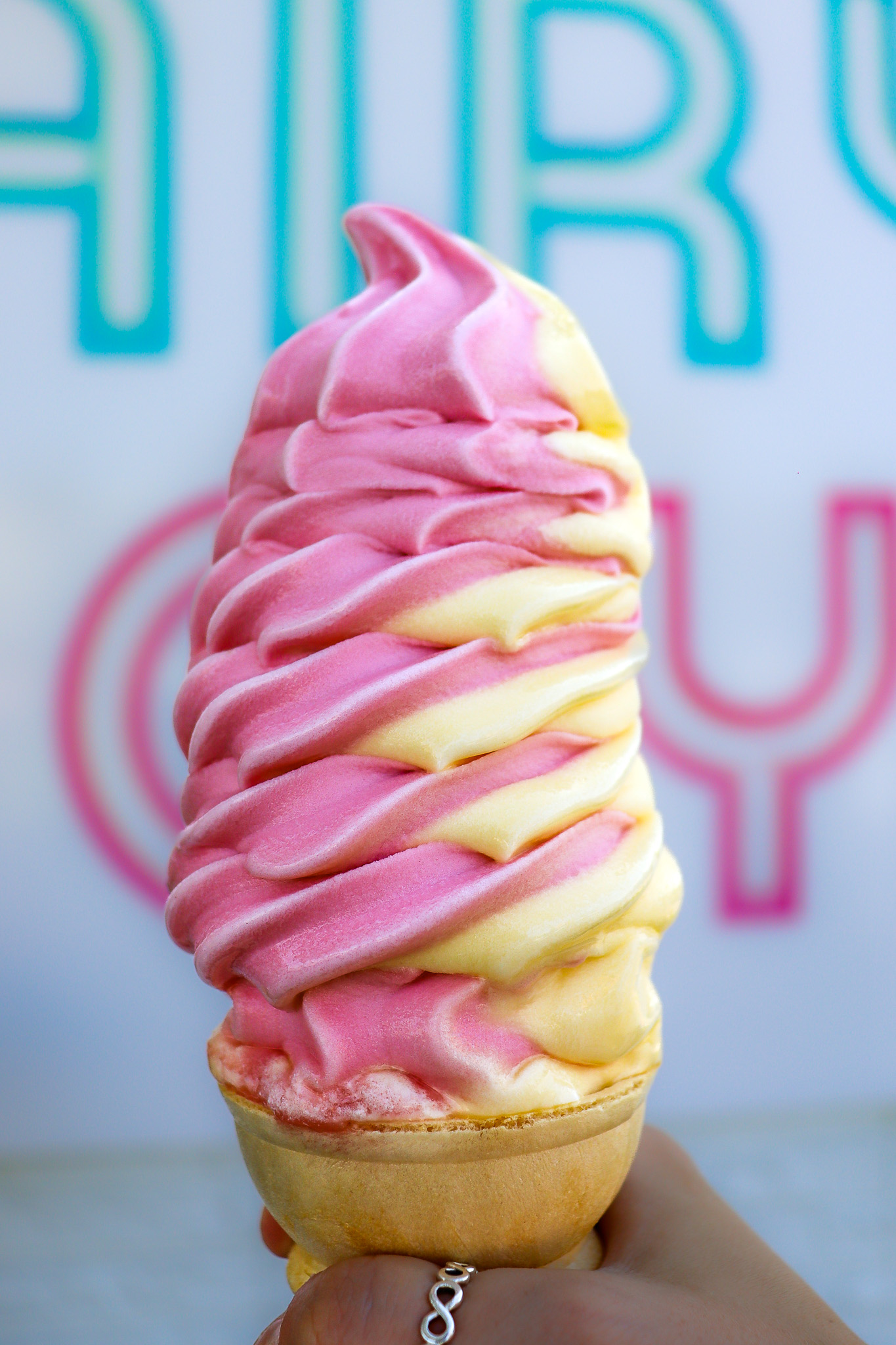 Rainbow Swirl Soft Serve Tampa Close-up of pink and yellow swirl soft serve