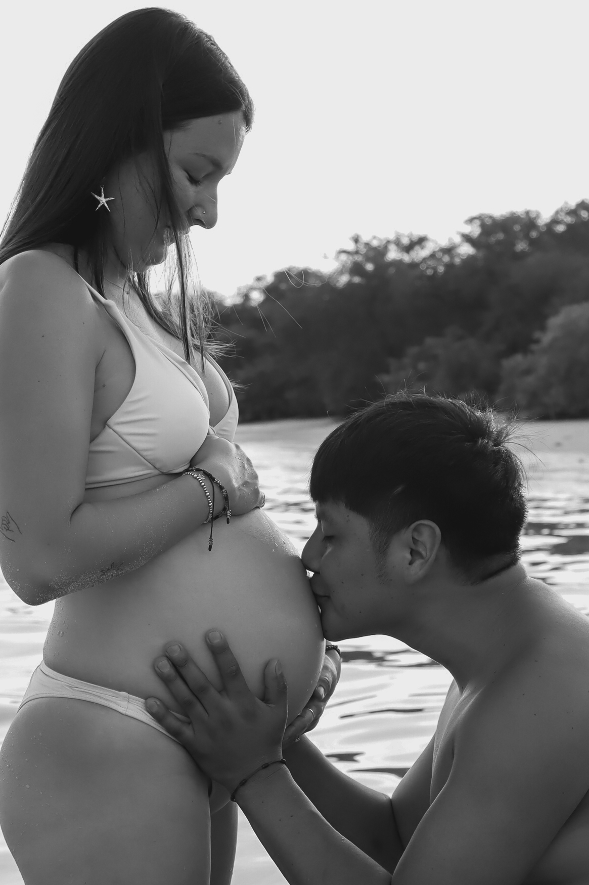 Expecting Couple Embracing Beachside Maternity Moment in St Pete, Florida