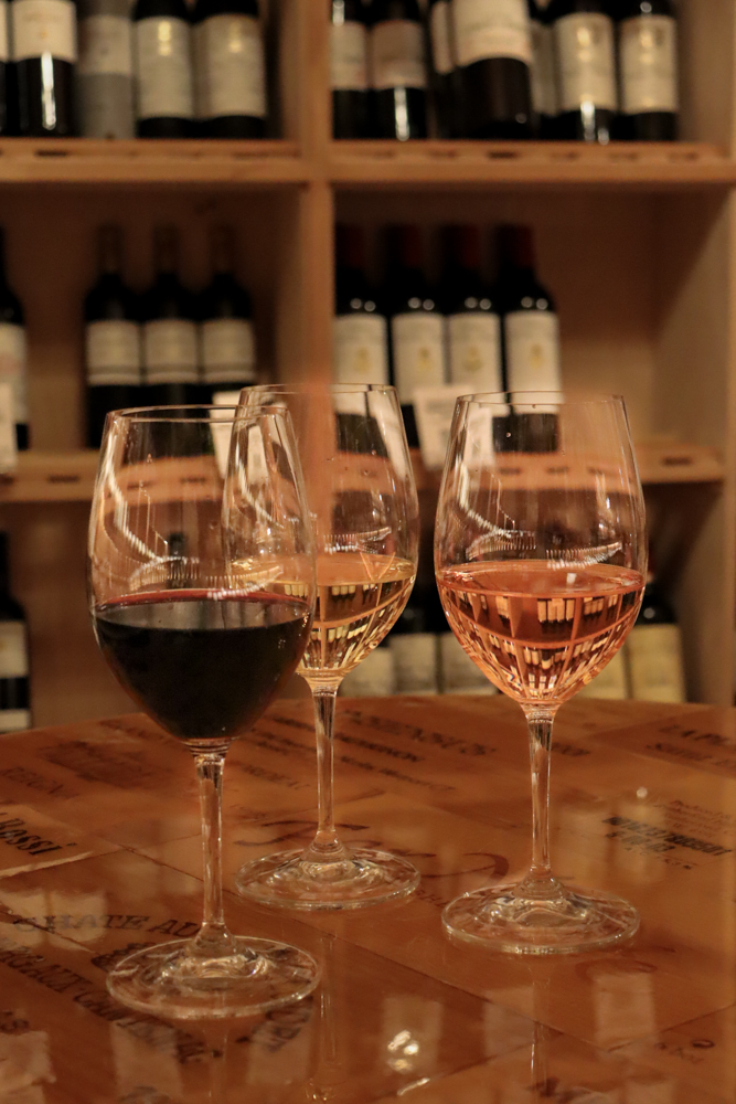 Wine Tasting Flight – Tampa Lifestyle Photography Three glasses of wine with different color profiles