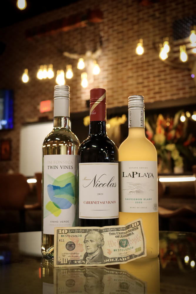 Wine Product Trio – Tampa Content Creation Product trio of wine bottles with branding focus