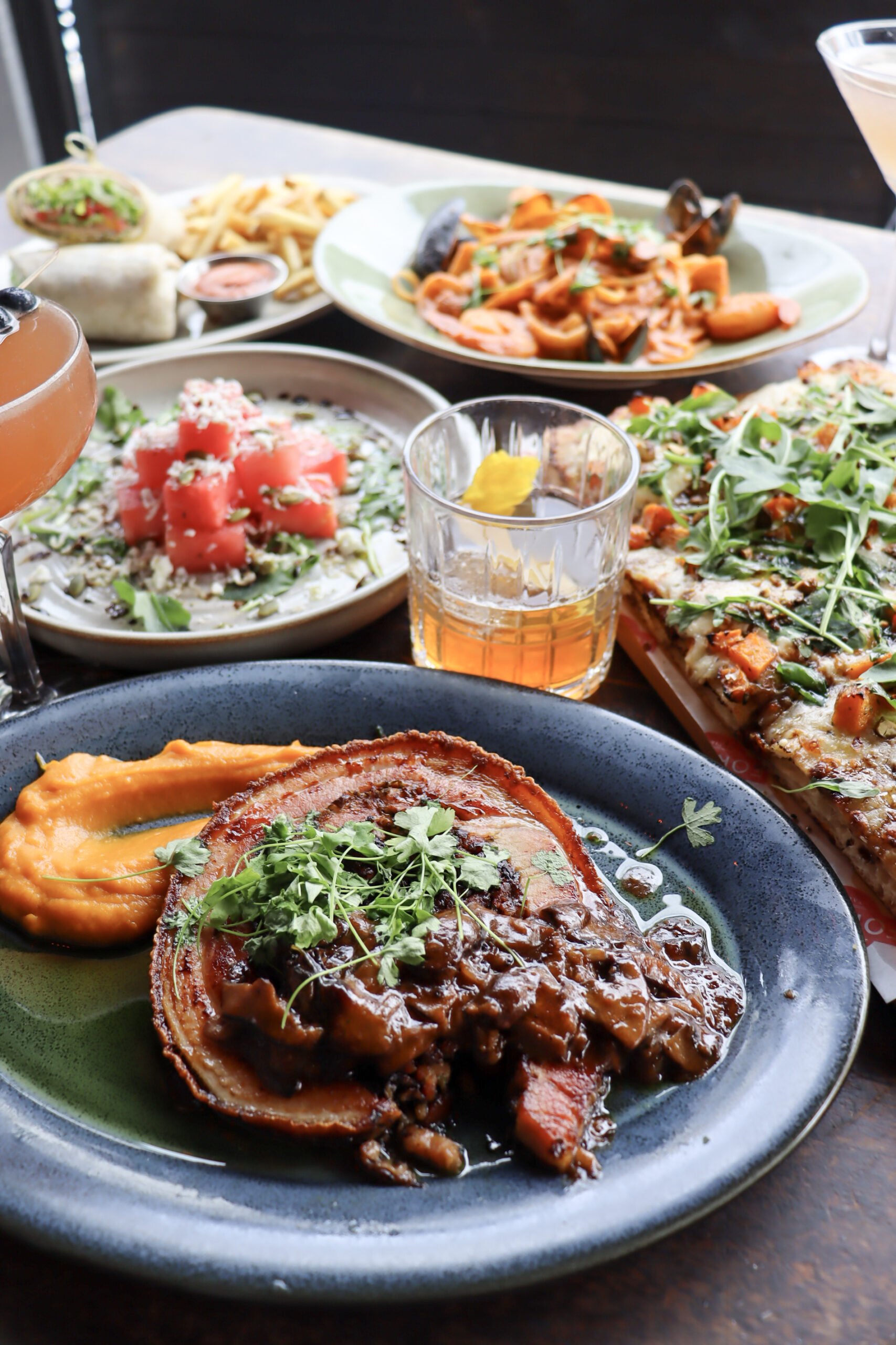Enchilada Food Photography Tampa Enchilada plate with rice and garnish on a blue dish
